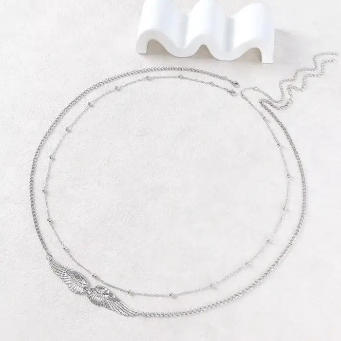 Chaîne de corps élégante à double couche avec ailes, perles et breloques, chaîne de taille dorée, ceinture de bikini stylée, accessoires de festival