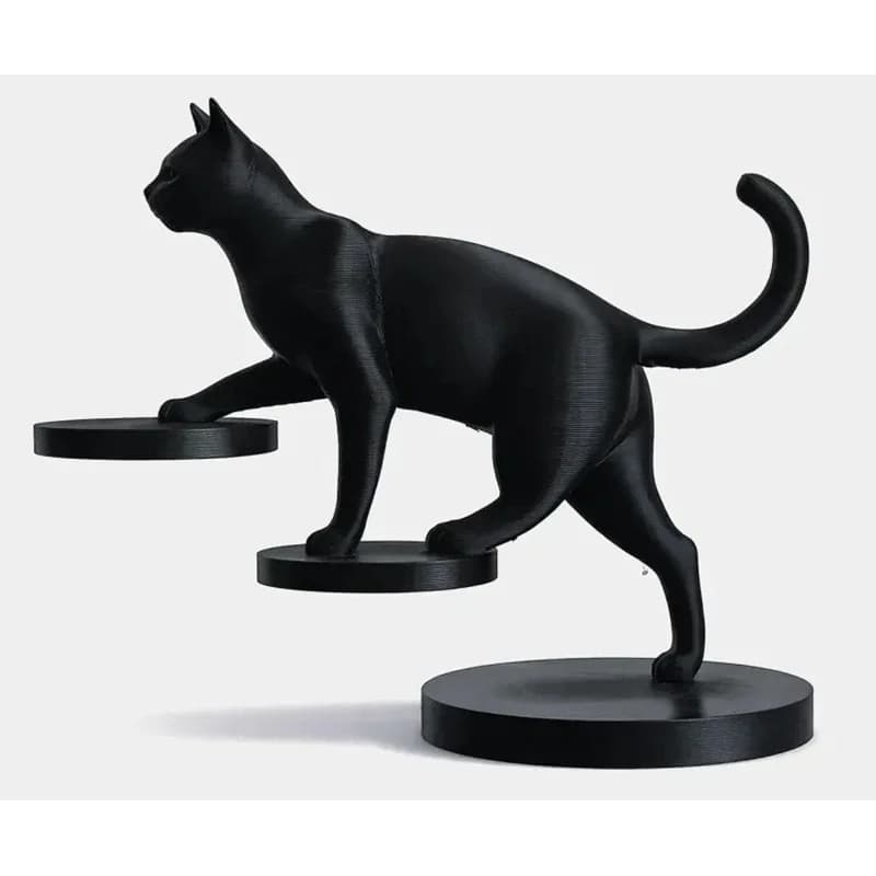 La technologie 3D crée des designs exquis et tridimensionnels. Figurine de chat équilibré imprimée e