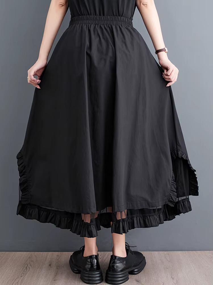 Jupe mi-longue décontractée noire vintage à empiècements en maille, taille haute, coupe irrégulière,