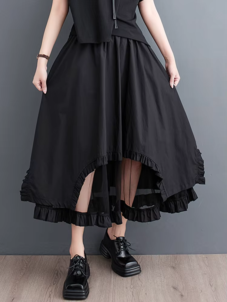 Jupe mi-longue décontractée noire vintage à empiècements en maille, taille haute, coupe irrégulière,