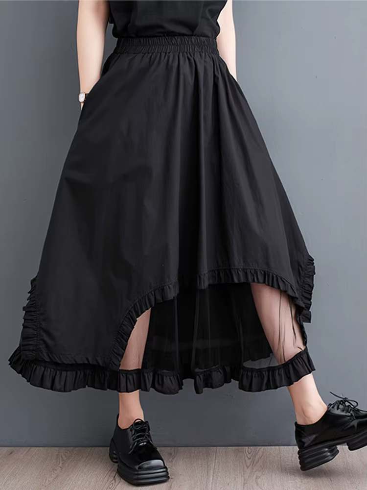 Jupe mi-longue décontractée noire vintage à empiècements en maille, taille haute, coupe irrégulière,