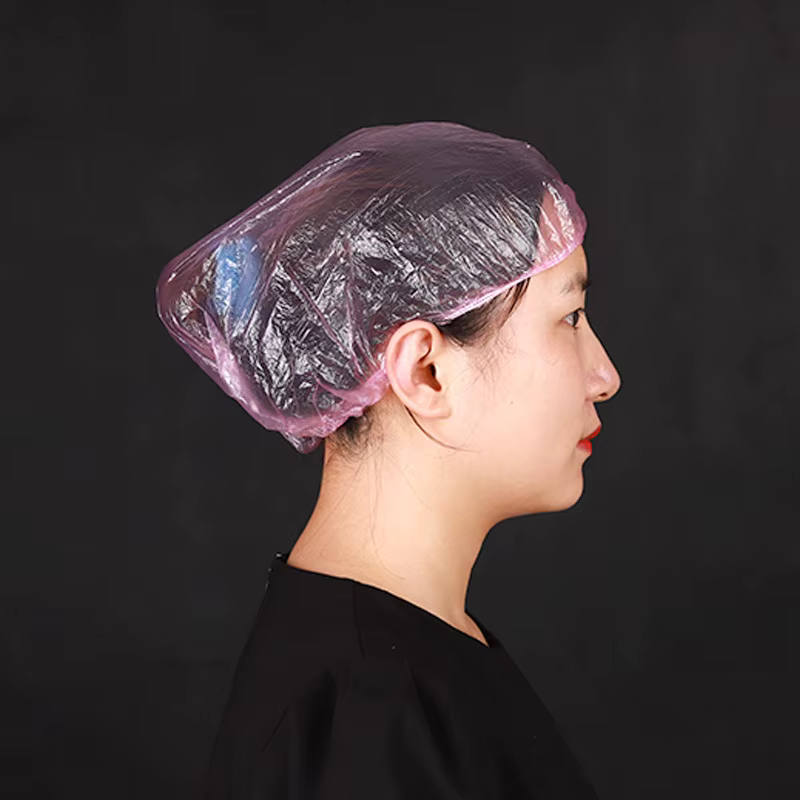 50/pièces/ensemble jetable en plastique douche bonnet de cheveux femmes imperméable rose Salon de Sp