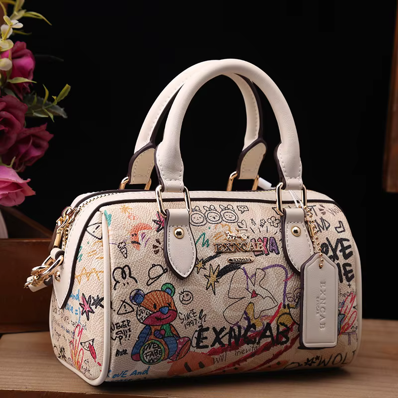 Sac Boston de luxe et vintage à porter à la main avec motifs graffiti de dessins animés tendance et