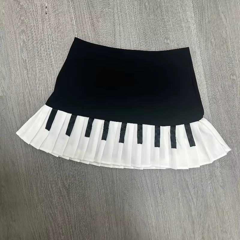 Printemps noir blanc épissé femmes jupe courte Y2k conception mince Harajuku Mini jupe femme Empire